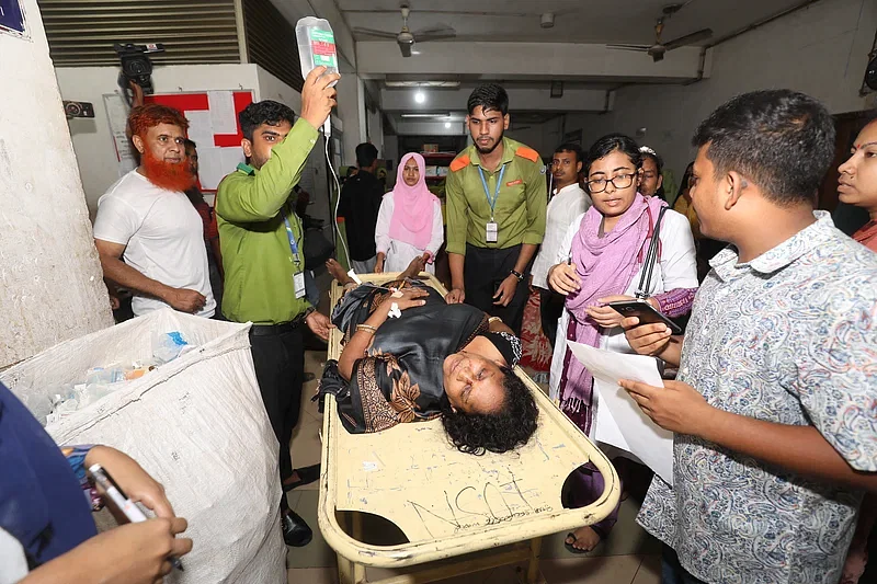 An injured undergoes treatment at Shaheed Ziaur Rahman Medical College Hospital in Bogura on 7 July 2024